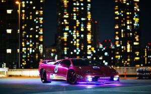 Purple Lamborghini supercar, night, buildings, lights wallpaper thumb