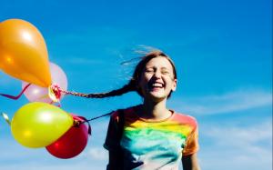 Happy girl with balloons wallpaper thumb
