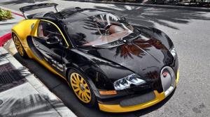 Bugatti Veyron luxury car parked on the roadside wallpaper thumb