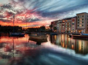 Sunset, dusk, houses, river, boats, water reflection wallpaper thumb