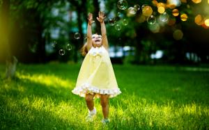 Little Girl Playing with Bubbles wallpaper thumb