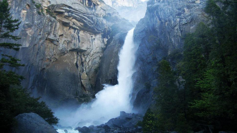 Mighty Yosemite Waterfall wallpaper,trees HD wallpaper,cliff HD wallpaper,waterfall HD wallpaper,rocks HD wallpaper,nature & landscapes HD wallpaper,1920x1080 wallpaper
