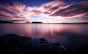 Purple sunset, white clouds in the sky, lake water wallpaper thumb
