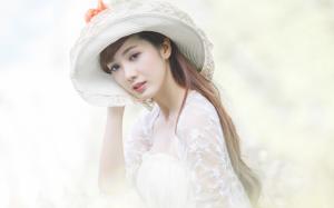 Asian girl with a hat wallpaper thumb