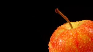 Orange apple covered with water beads wallpaper thumb
