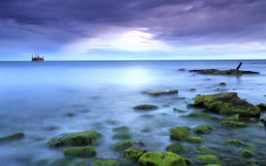 Sea, rocks, moss, blue, sun, clouds wallpaper thumb