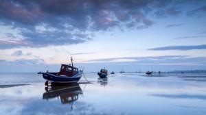 The Fishing Fleet On The Beach At Low Tide wallpaper thumb