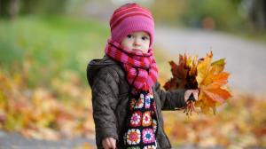 Cute Child With Autumn Leaves wallpaper thumb