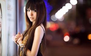 Asian girl at city street night wallpaper thumb