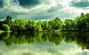 Beautiful lake, water reflection, trees, thick clouds wallpaper thumb