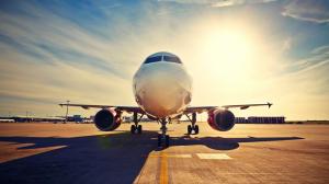 Passenger plane, airport, runway, sun rays wallpaper thumb