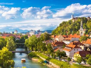 Beautiful Ljubljana city in Slovenia, houses, river, trees, mountains, clouds wallpaper thumb