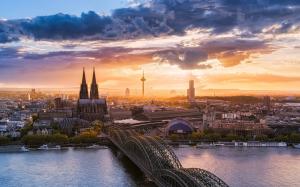 Beautiful Cologne city, Germany, sunset, bridge, river, houses, sky, clouds wallpaper thumb