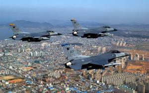 F 16 Fighting Falcons Over City HD wallpaper thumb