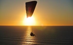 sea, sunset, flying, people, water, sunrise, silhouette, joy , fun, adventure, parachute wallpaper thumb