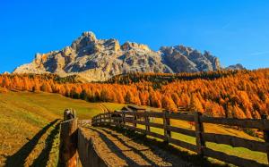 Autumn landscape, red trees, mountains, sky, clouds, houses, fence wallpaper thumb