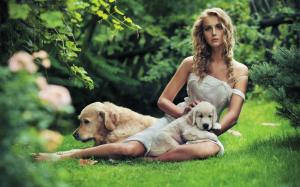 Beautiful girl with a dog in the grass wallpaper thumb