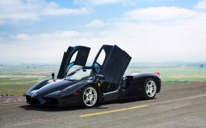 Ferrari Enzo black color supercar, doors opened wallpaper thumb