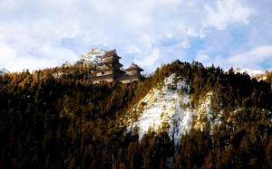 Japanese Castle On A Mountain In Winter wallpaper thumb