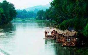 Huts On A Southeastern Asian River wallpaper thumb