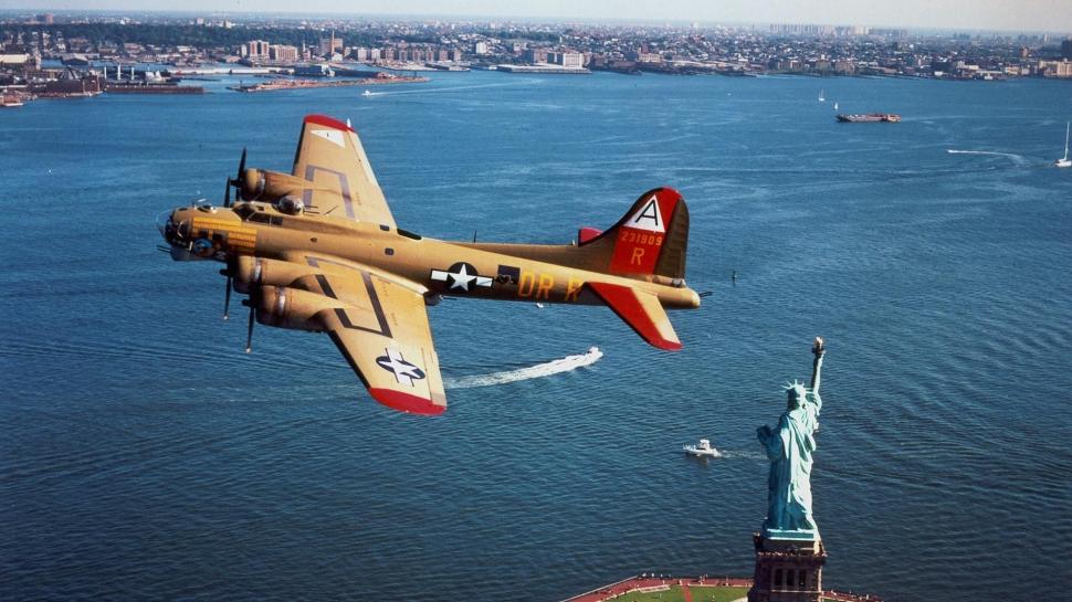B17 Flying Fortress Over The Statue Of Liberty wallpaper,bomber HD wallpaper,plane HD wallpaper,flying HD wallpaper,statue HD wallpaper,aircraft planes HD wallpaper,1920x1080 wallpaper