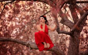 Red dress girl on the tree wallpaper thumb