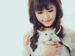 Smile Asian girl and white cat wallpaper thumb