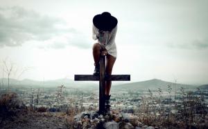 Girl with hat on a cross wallpaper thumb