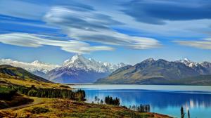 New Zealand, Lake Pukaki, mountains, trees, clouds wallpaper thumb