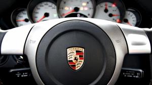 Porsche logo on stearing wheel wallpaper thumb