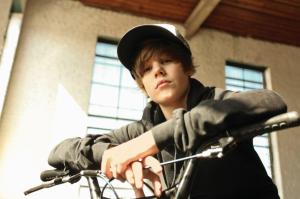 Justin Bieber on bike wallpaper thumb