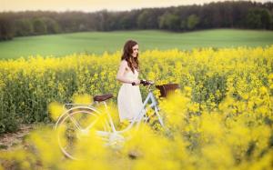 Smile girl, joy, bike, yellow flowers, field wallpaper thumb