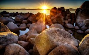 Beach with rocks on sunset wallpaper thumb