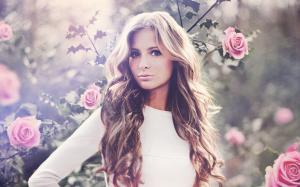 Blonde next to roses in bloom wallpaper thumb