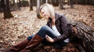 Smile girl sit on forest ground wallpaper thumb