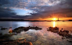 Sunlight Sunset Lighthouse Ocean Rocks Stones HD wallpaper thumb