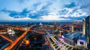 Astana, Kazakhstan, city landscape, dusk, lights, buildings, clouds wallpaper thumb