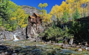 River, wood house, rocks, water, trees wallpaper thumb