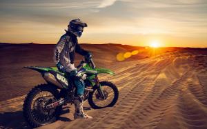 Motorcycle in sand wallpaper thumb