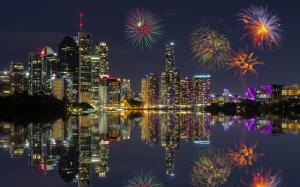 Buildings Skyscrapers Night Lights Reflection Fireworks HD wallpaper thumb