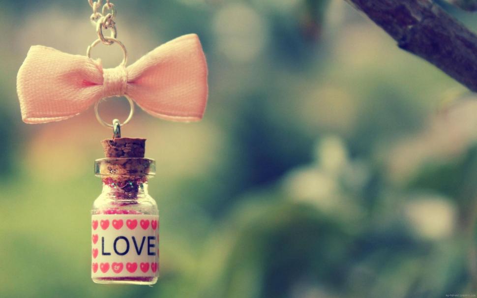 Vial of love hanging from a pink bow wallpaper,love HD wallpaper,vial HD wallpaper,bow HD wallpaper,pink HD wallpaper,heart HD wallpaper,1920x1200 wallpaper