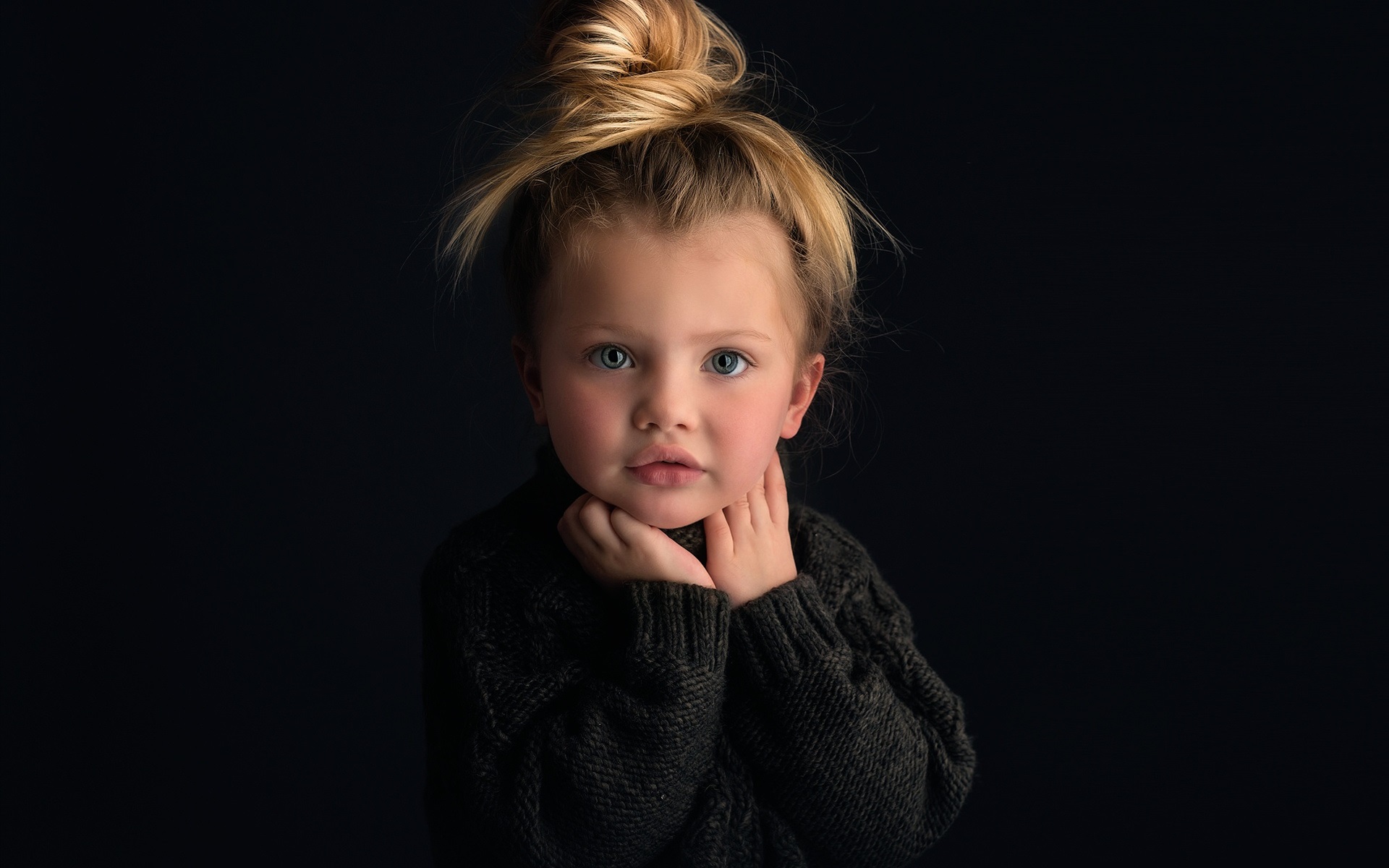  Cute  baby  girl  portrait blonde black  background 