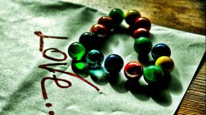 Love heart-shaped, colored glass beads wallpaper thumb