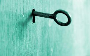 Key on a wooden door wallpaper thumb