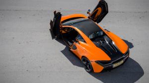 Mclaren 570S orange supercar top view, doors opened wallpaper thumb