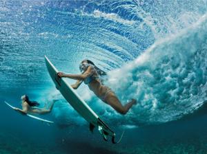 Surfing Girls Under A Wave wallpaper thumb