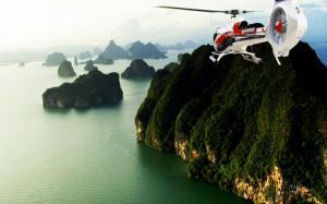 Helicopter Flies Over The Mountains wallpaper thumb
