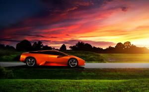 Lamborghini orange supercar at sunset wallpaper thumb