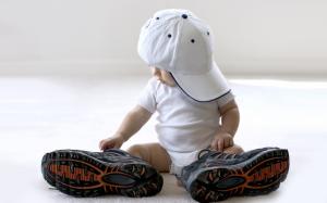 Wearing a pair of big shoes cute baby wallpaper thumb