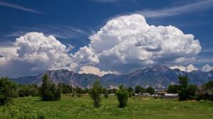 Magnificent Clouds Over Farms In The Meadow wallpaper thumb